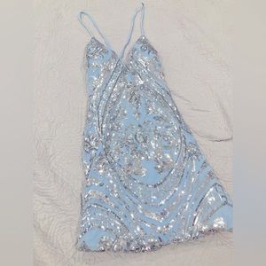 Small, blue dress with sequence design, low V neck, tie cross over back.